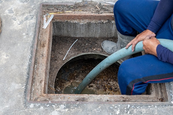 foul odors, slow draining sinks, and standing water are common indicators that a grease trap needs pumping